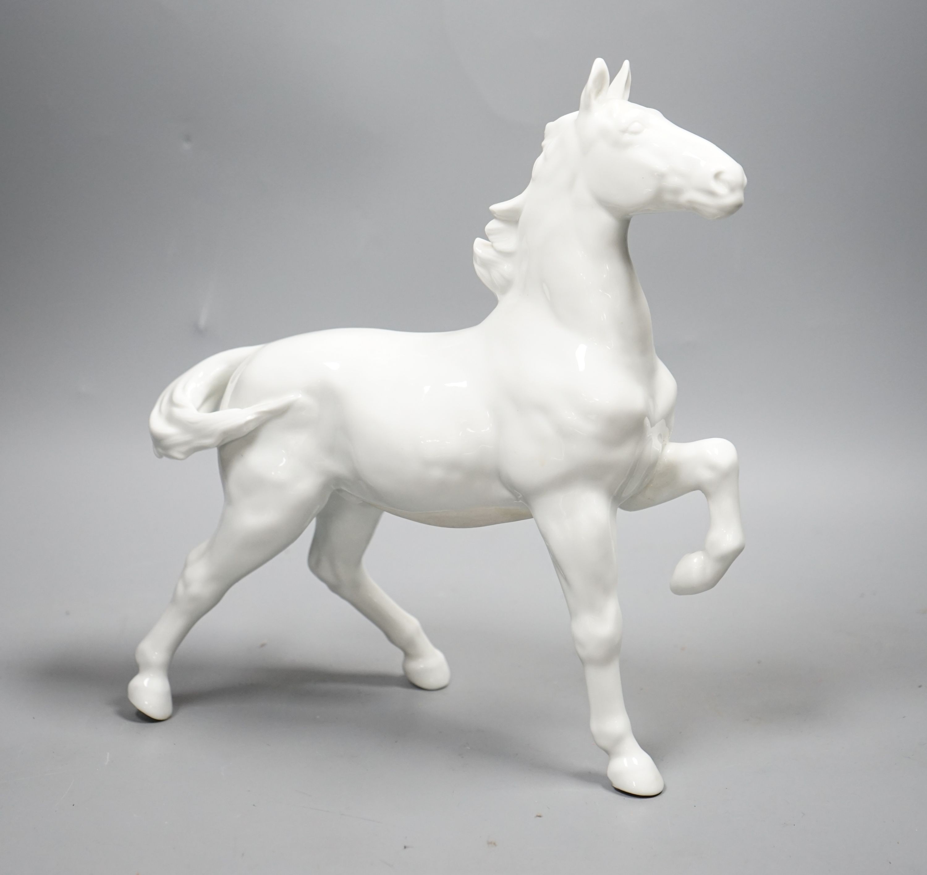 A Japanese porcelain figure of a horse, a Chinese blue and white dish, a Southeast Asian metal bowl and various reproduction coins